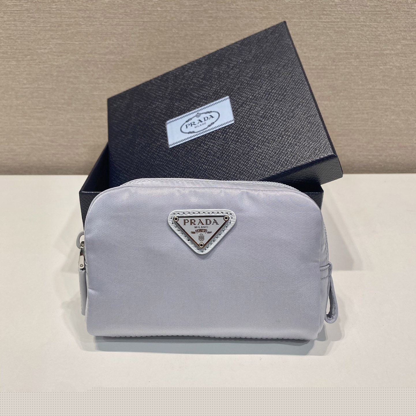 Pra*a clutch bags